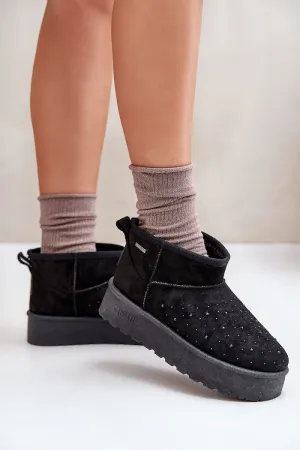 Low snow boots set on a platform
