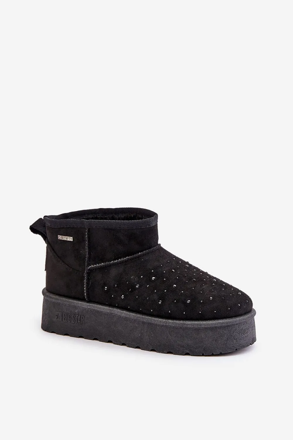 Low snow boots set on a platform